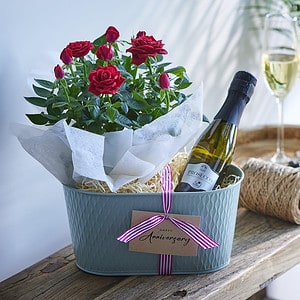 Anniversary Rose Gift Set with red roses and a bottle of wine.