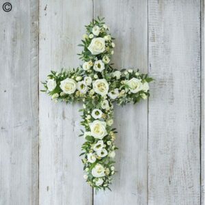 Floral White Open Cross arrangement on a wooden background.