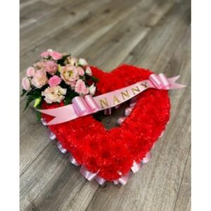 A Red and Pink Open Heart floral tribute with sash that reads "nanny", perfect as a Valentine's Day decoration.