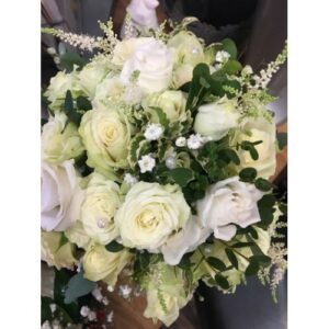 A bouquet of white roses and greenery, ideal for Wedding planning.