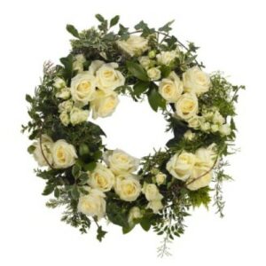 White Bloom Wreath consisting of white roses and assorted green foliage.