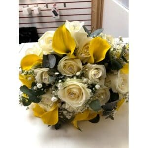A bouquet of yellow and white roses with baby's breath and greenery, perfect for Wedding planning.